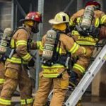 firefighters on ladder